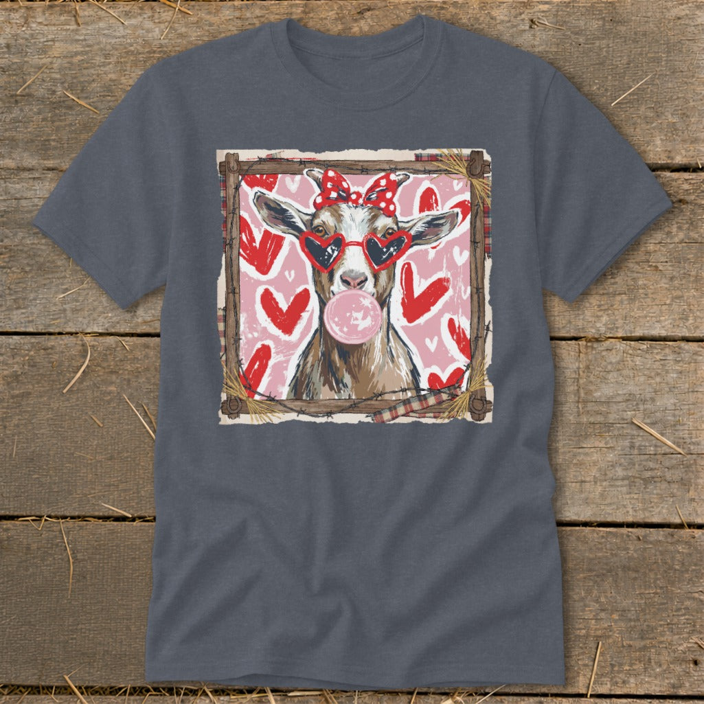 Goat wearing heart sunglasses and red bow blowing bubblegum, surrounded by hearts.
