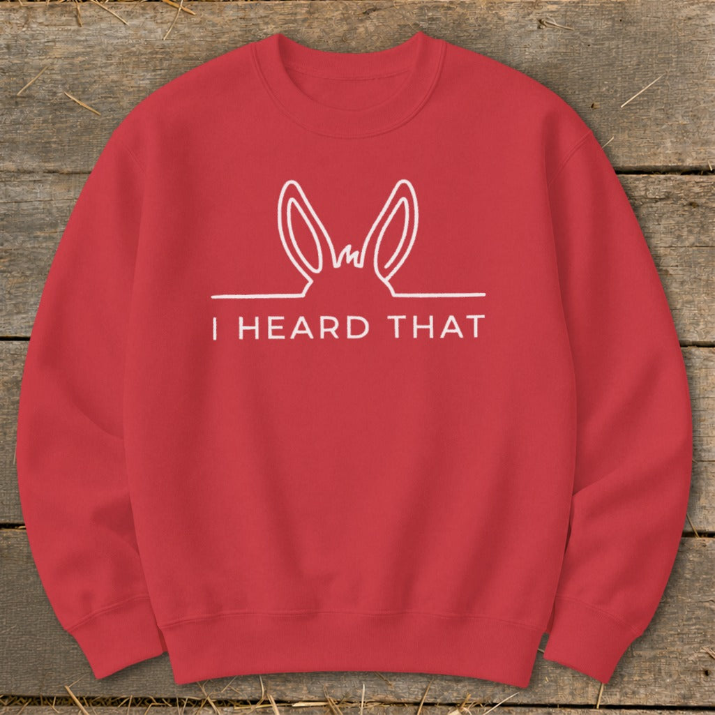 Red sweatshirt with white line drawing of donkey ears and text "I HEARD THAT".