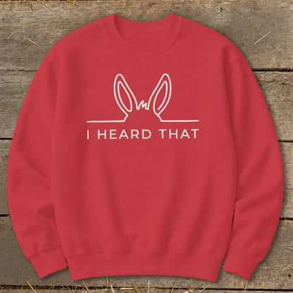 Red sweatshirt with white line drawing of donkey ears and text "I HEARD THAT".
