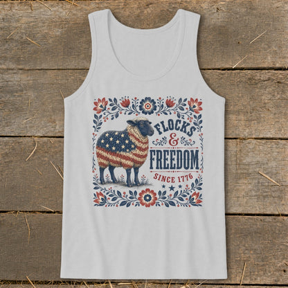 Sheep with American flag pattern on fleece, surrounded by floral border and text "Flocks & Freedom Since 1776".