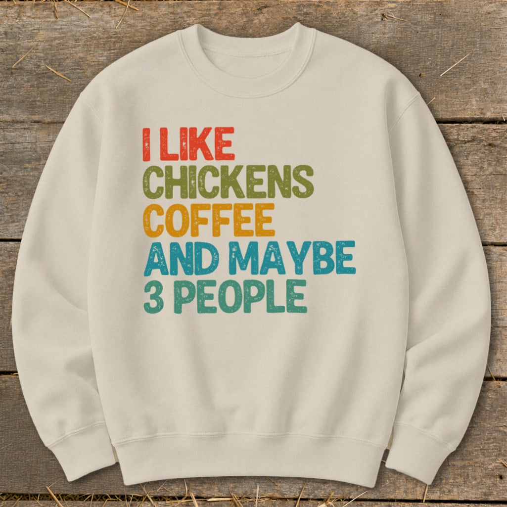 Cream sweatshirt with text "I LIKE CHICKENS COFFEE AND MAYBE 3 PEOPLE".