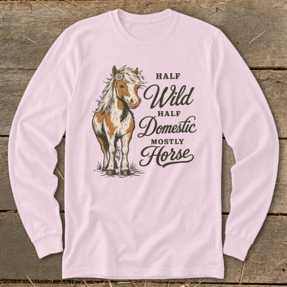Pink long-sleeve shirt with a horse illustration and text "Half Wild, Half Domestic, Mostly Horse".