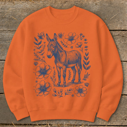 Orange crewneck sweatshirt with blue donkey and floral graphic.