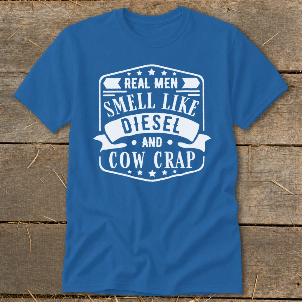 Blue t-shirt with white text: "Real men smell like diesel and cow crap."