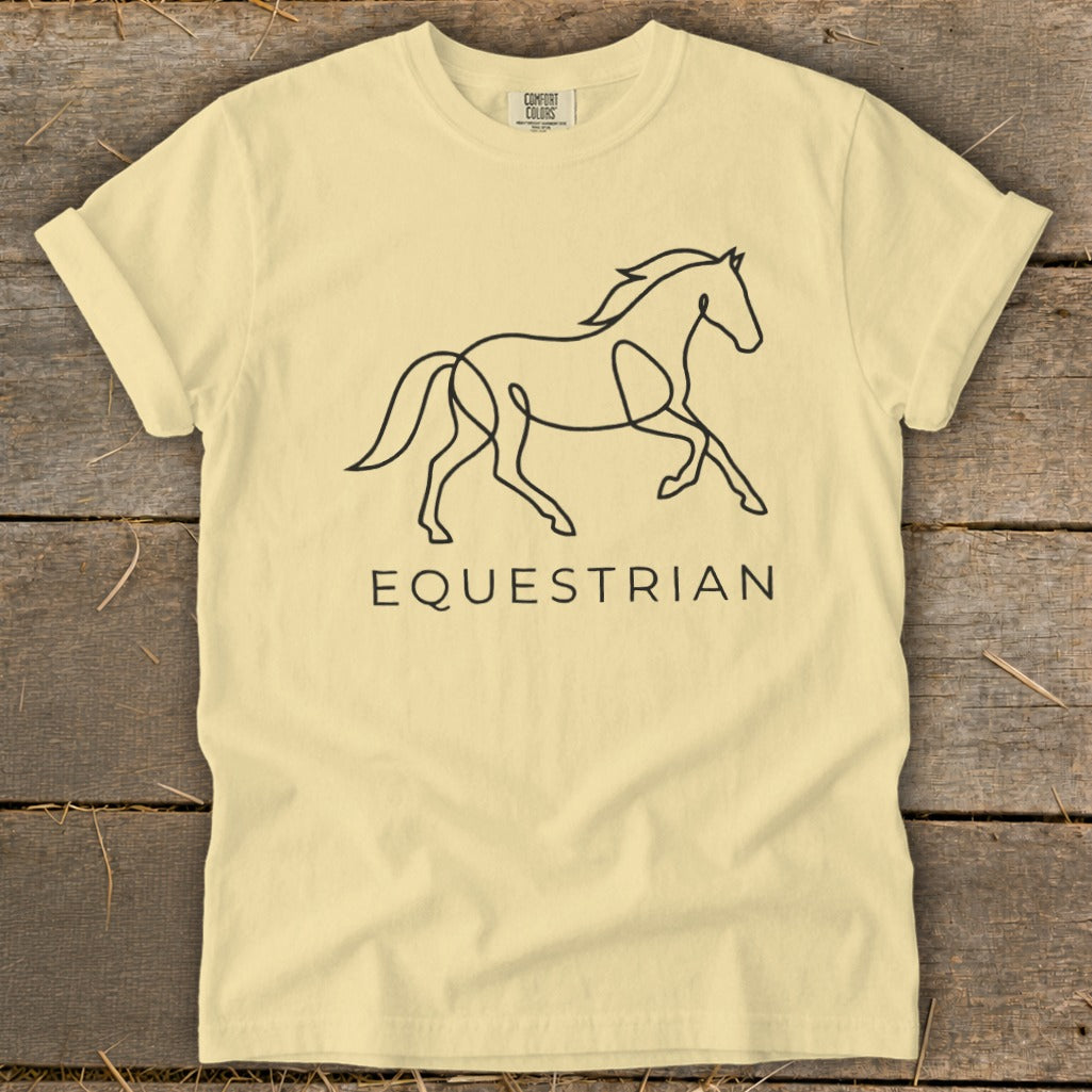 Pale yellow t-shirt with a minimalist black line drawing of a galloping horse and the word "EQUESTRIAN".