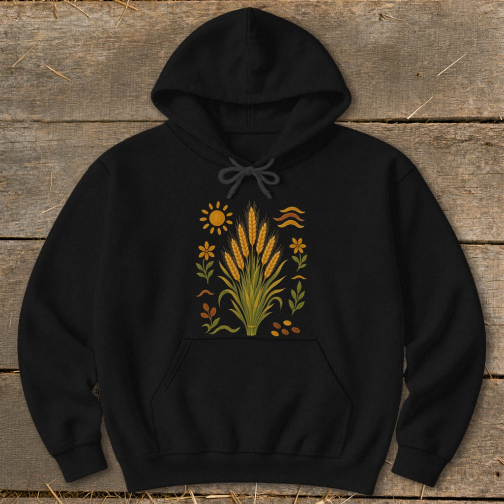 Black hoodie with a central graphic of wheat stalks, sun, flowers, and seeds.