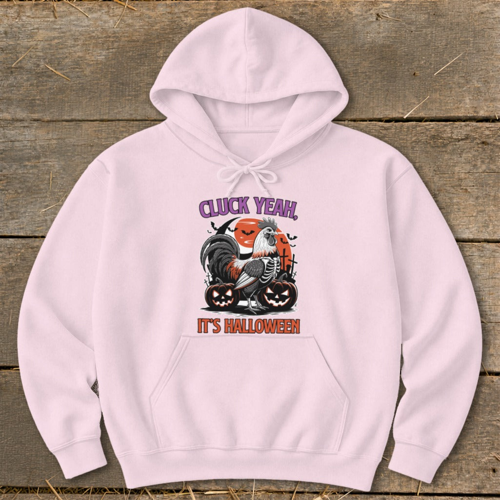 Pink hoodie with a Halloween graphic of a skeleton rooster, pumpkins, and text "CLUCK YEAH, IT'S HALLOWEEN".