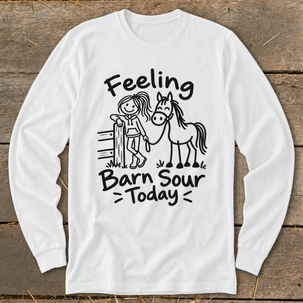 White long-sleeve shirt with illustration of girl and horse, reads "Feeling Barn Sour Today".