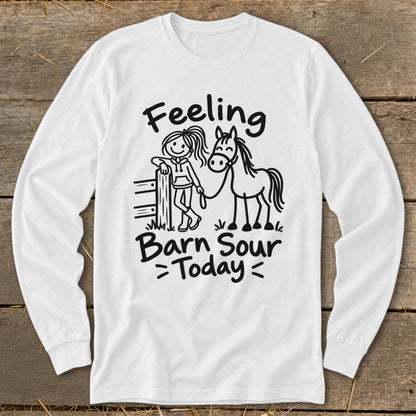 White long-sleeve shirt with illustration of girl and horse, reads "Feeling Barn Sour Today".