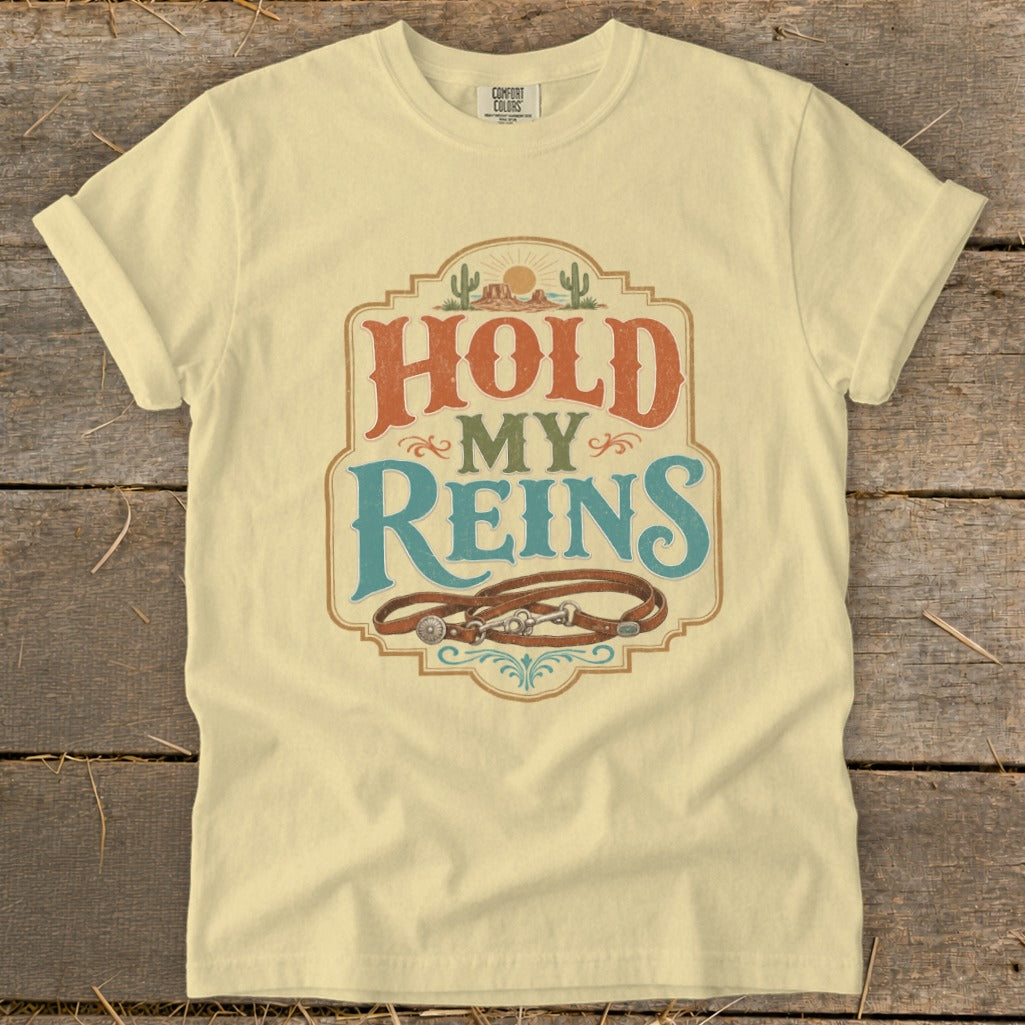 Yellow t-shirt with "Hold My Reins" text and horse reins graphic.