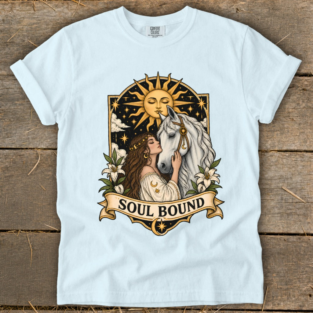 Light blue t-shirt with "Soul Bound" text featuring a woman and horse under a sun.