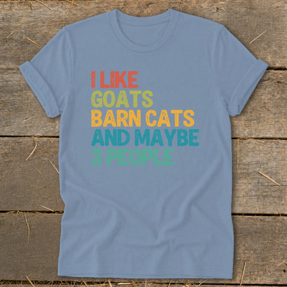 Light blue t-shirt with "I like goats barn cats and maybe 3 people" text.