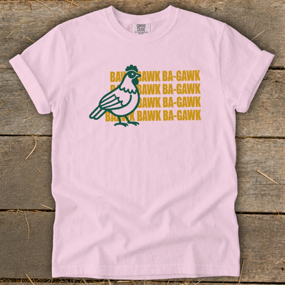 Pink t-shirt with green chicken graphic and "Bawk Ba-Gawk" text.