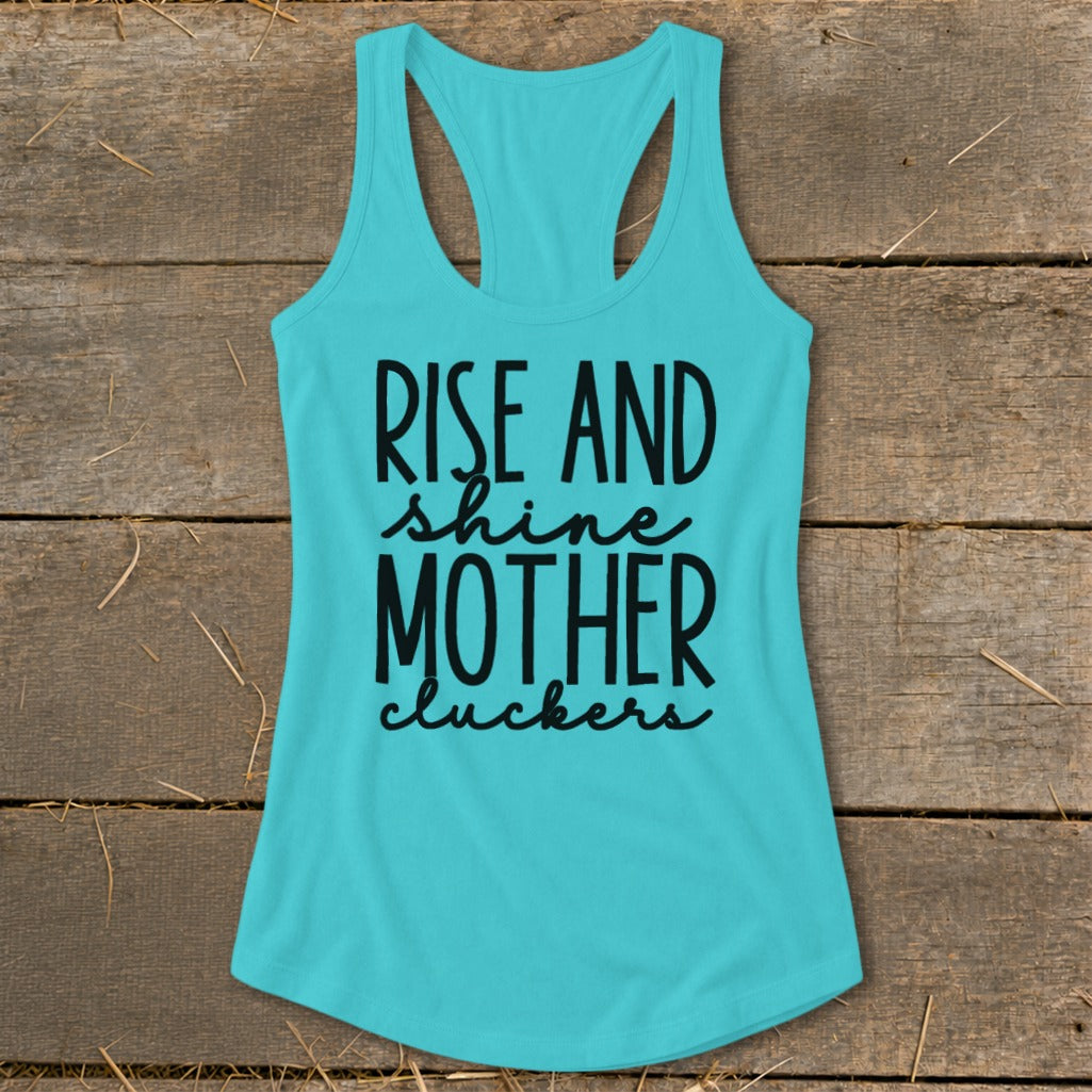 Teal tank top with "Rise and shine mother cluckers" in black text.