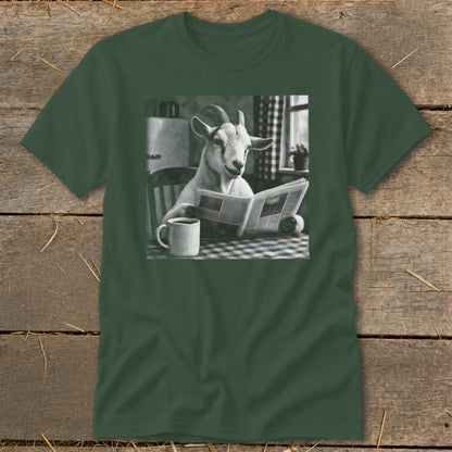 A dark green t-shirt featuring a black and white graphic of a goat reading a newspaper at a table with a mug of coffee.