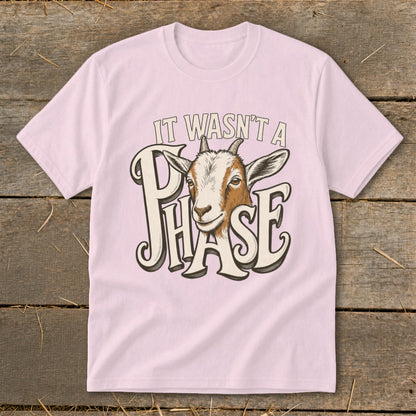 Pink t-shirt with a goat graphic and text "IT WASN'T A PHASE".