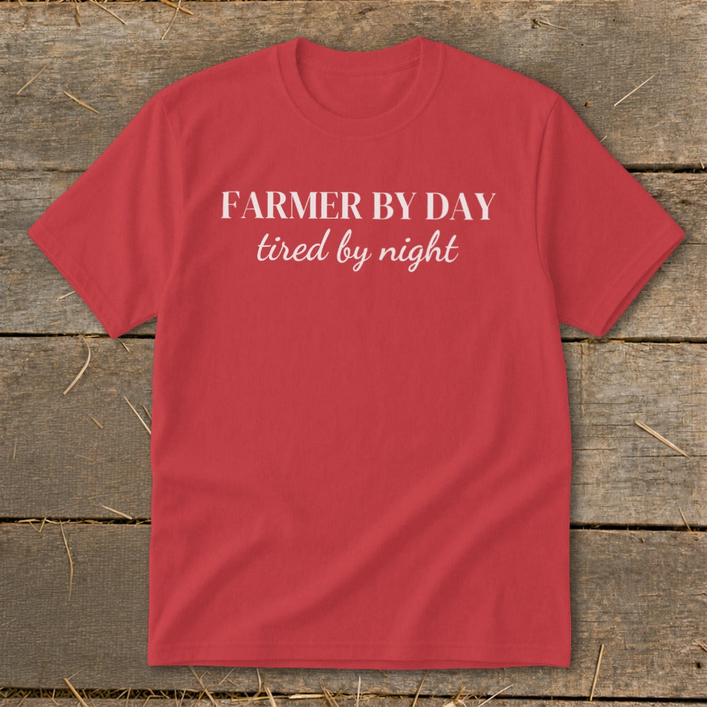 Red t-shirt with white text that reads "FARMER BY DAY tired by night".