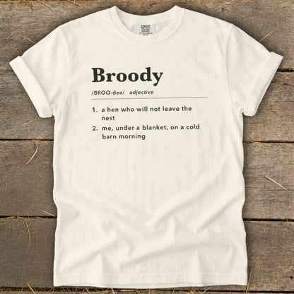 White t-shirt with "Broody" definition: "a hen who will not leave the nest" and "me, under a blanket".
