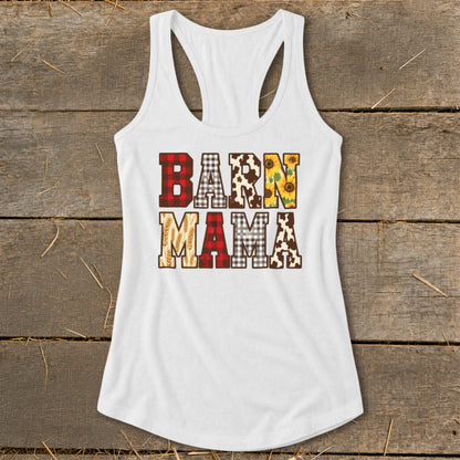 White tank top with "Barn Mama" text in patterned letters including plaid and sunflowers.