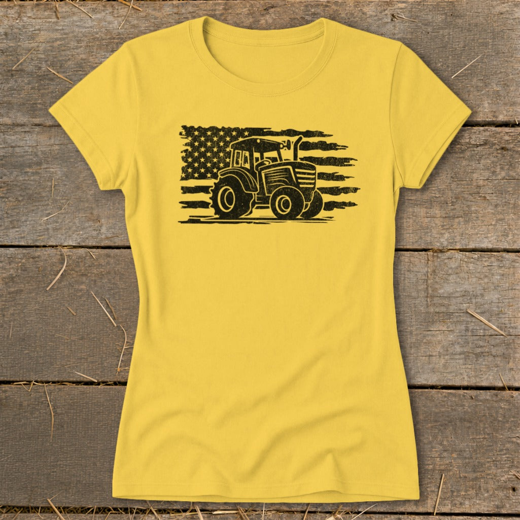 Yellow t-shirt with black distressed tractor and American flag graphic.