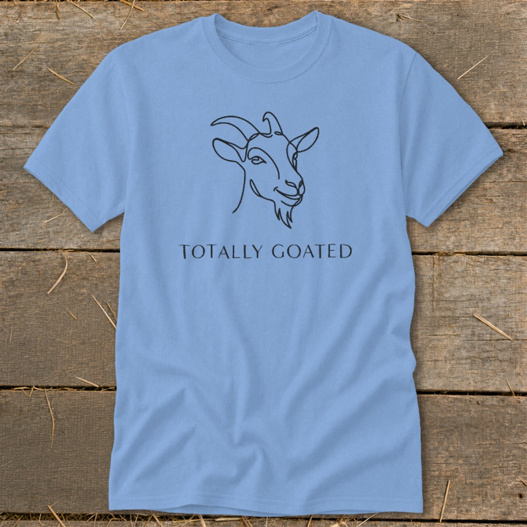 Light blue t-shirt with a minimalist goat line drawing and text "TOTALLY GOATED".