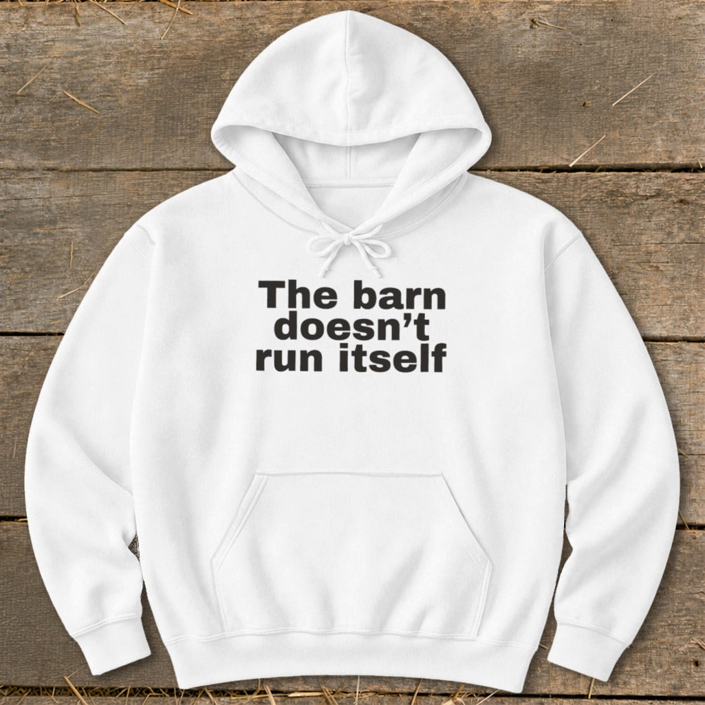 White hoodie with black text that reads "The barn doesn't run itself".