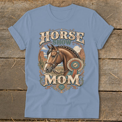 Horse Show Mom text with a horse head and award ribbon on a blue t-shirt.