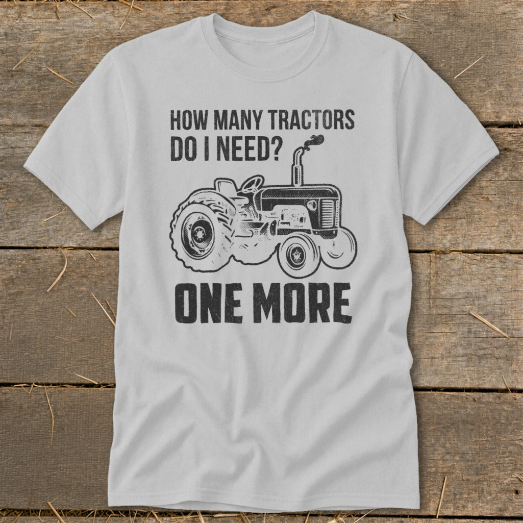T-shirt with graphic: "How many tractors do I need? One More" and a tractor illustration.