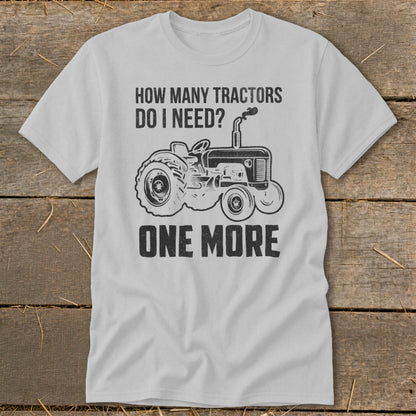 T-shirt with graphic: "How many tractors do I need? One More" and a tractor illustration.