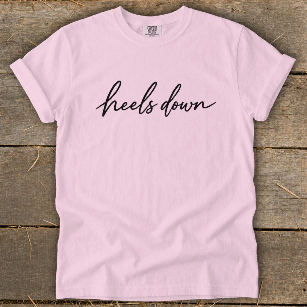 Light pink t-shirt with "heels down" text, Comfort Colors tag.