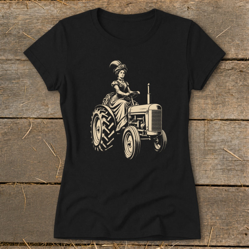 Black t-shirt with vintage illustration of a woman in a formal dress driving a tractor.