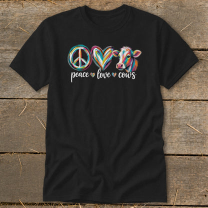 Black t-shirt with a peace sign, heart, and colorful cow design, reading "peace love cows".