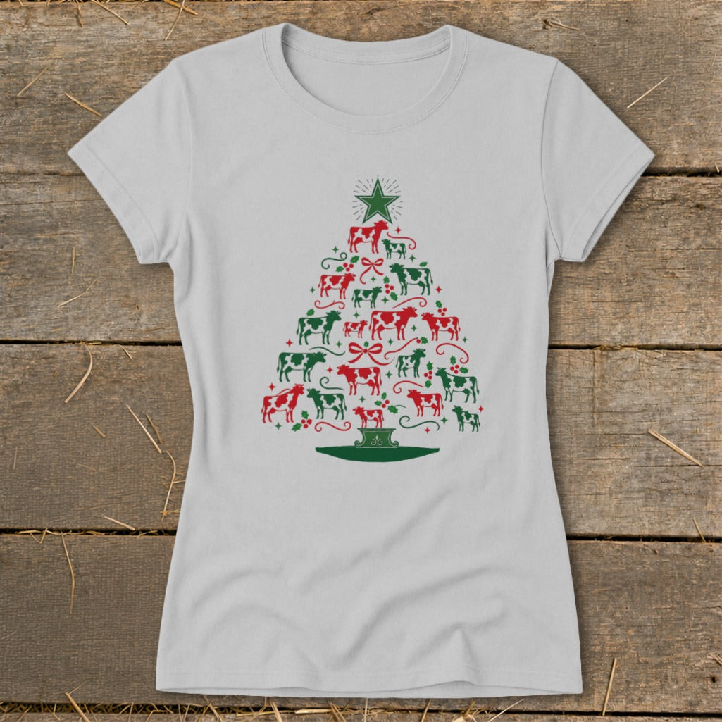 Light grey t-shirt with a Christmas tree made of red and green cows and holly.