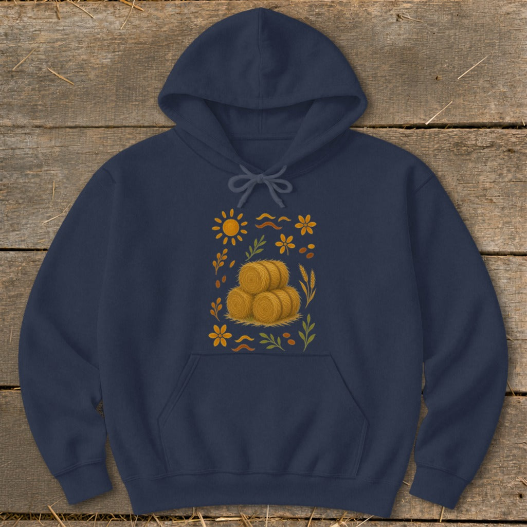 Navy hoodie with a central illustration of three hay bales surrounded by fall foliage and sun elements.