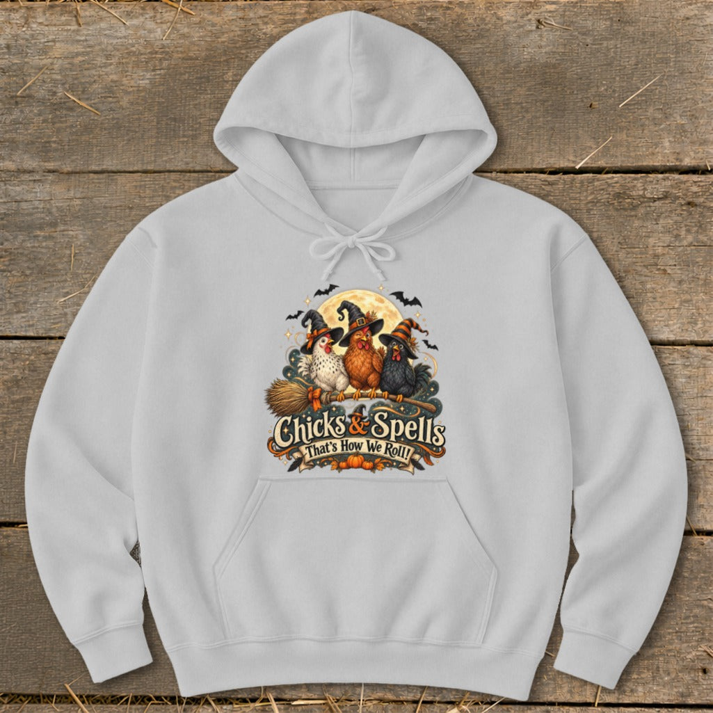 Light grey hoodie with Halloween graphic of three chickens in witch hats on a broom.