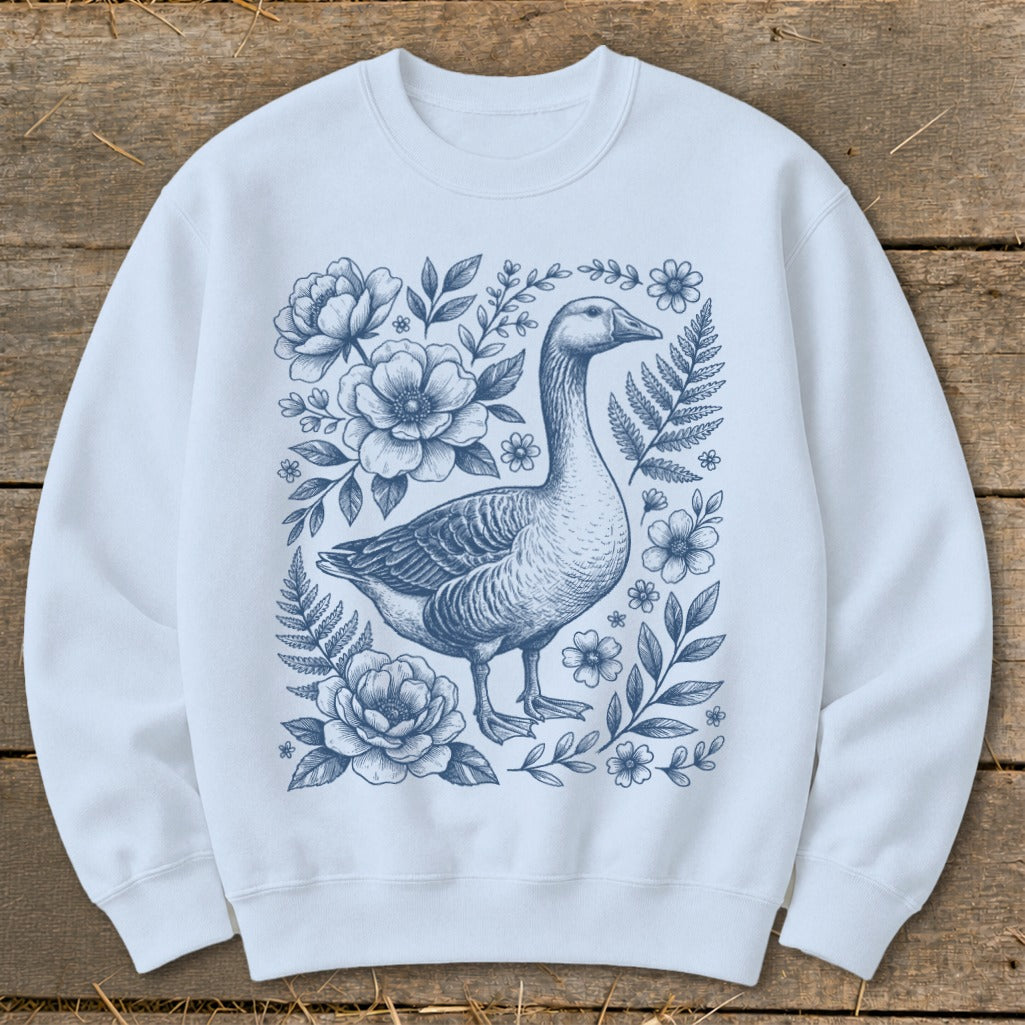 Light blue sweatshirt with blue goose and floral sketch design.