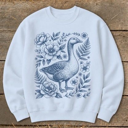 Light blue sweatshirt with blue goose and floral sketch design.