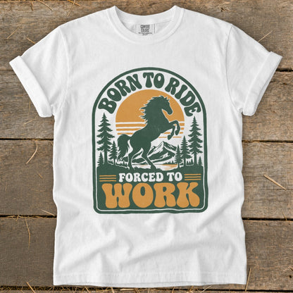 White t-shirt with a retro graphic of a horse ready to buck, text reads "Born to Ride" and "Forced to Work".