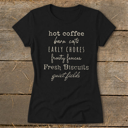 Black t-shirt with text: hot coffee, barn cats, early chores, frosty fences, fresh biscuits, quiet fields.