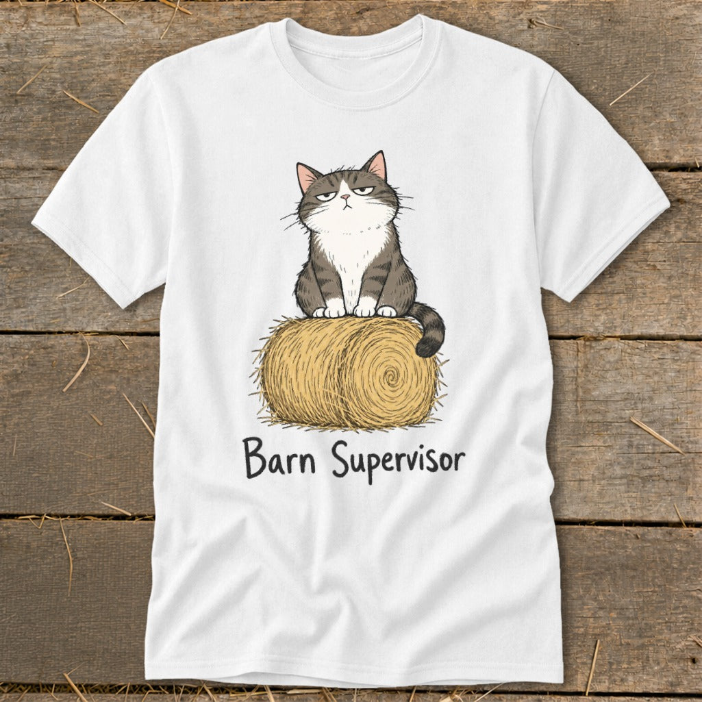 White t-shirt with cartoon cat sitting on hay bale, text "Barn Supervisor".