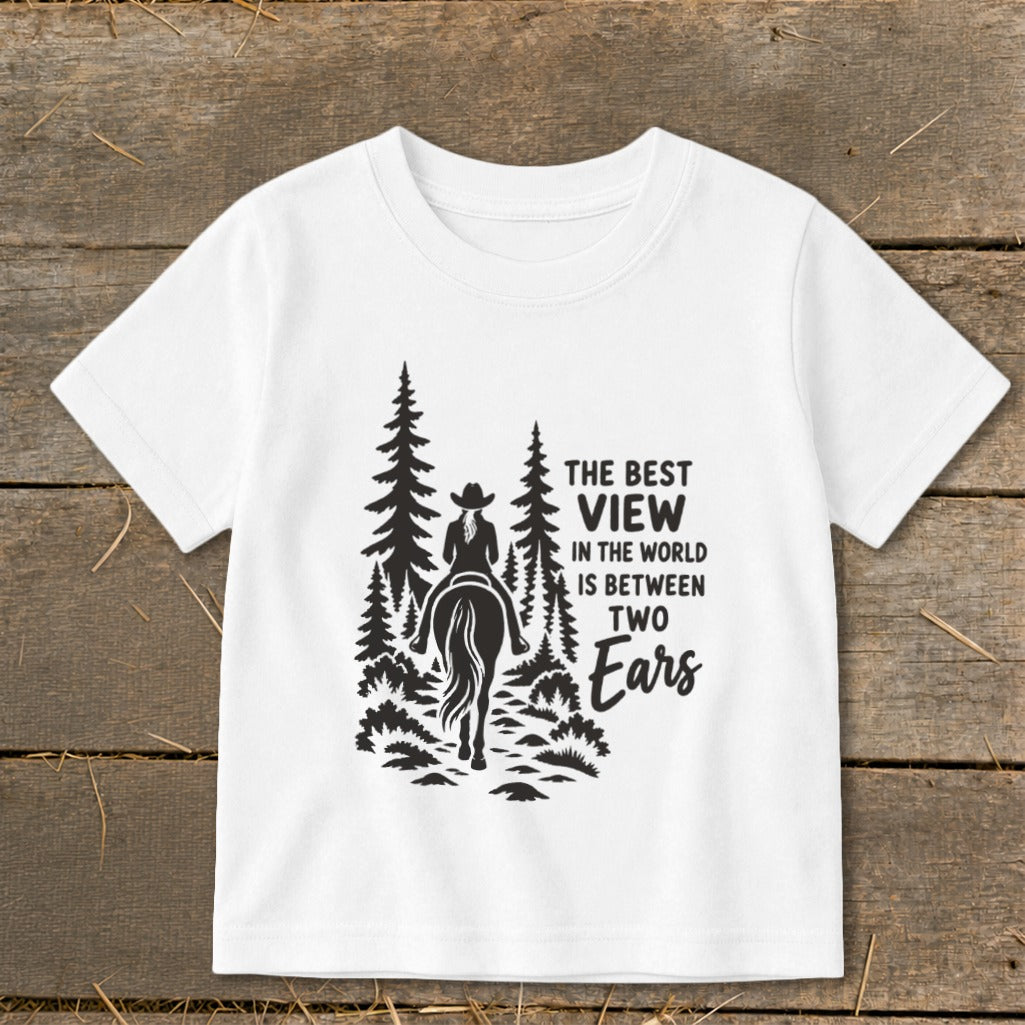 White t-shirt featuring a black graphic of a horse rider in the forest with text.