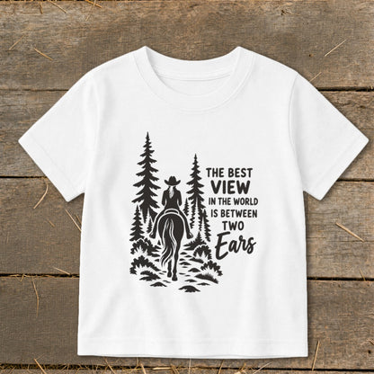 White t-shirt featuring a black graphic of a horse rider in the forest with text.