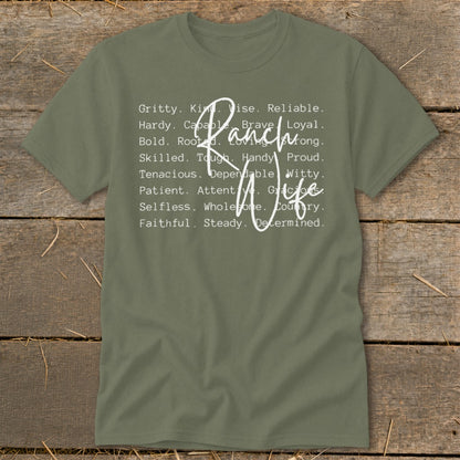 Olive green t-shirt with "Ranch Wife" and positive attributes listed around it.