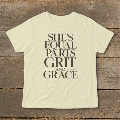 Light yellow t-shirt with "She's Equal Parts Grit and Grace" text.