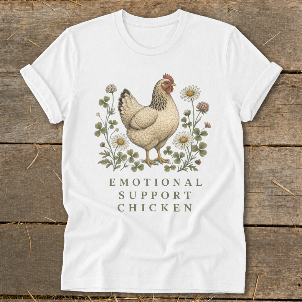 White t-shirt with a chicken illustration surrounded by flowers and text.
