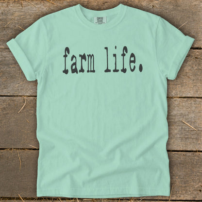 Light green t-shirt with "farm life." printed in black ink.
