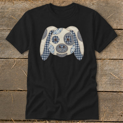 Black t-shirt with a fabric applique of a dog's face.