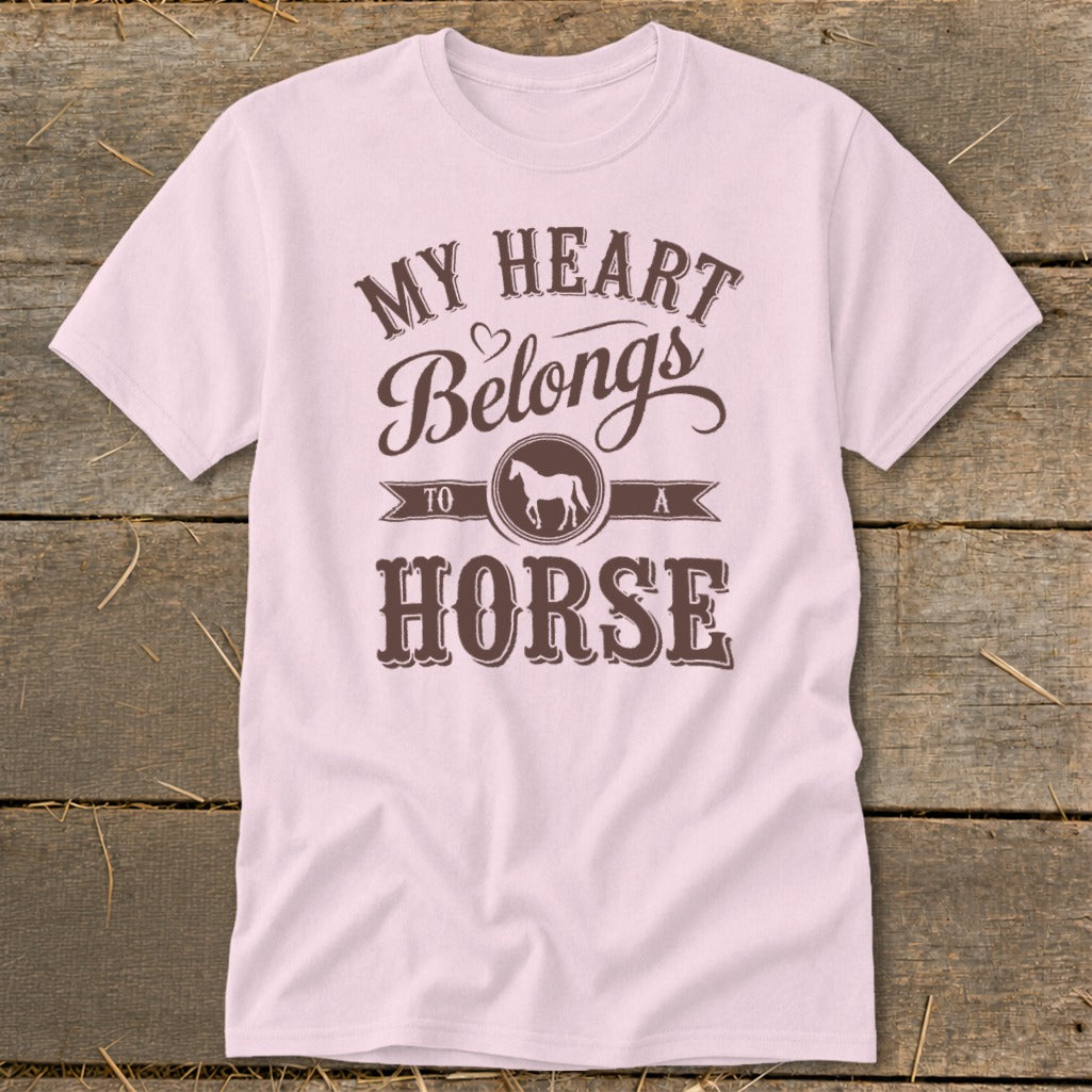 Pink t-shirt with brown text and horse graphic reading "My Heart Belongs To A Horse".