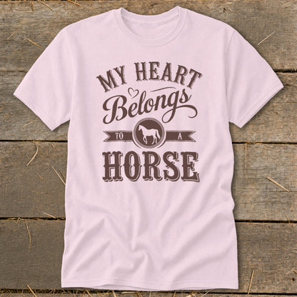 Pink t-shirt with brown text and horse graphic reading "My Heart Belongs To A Horse".