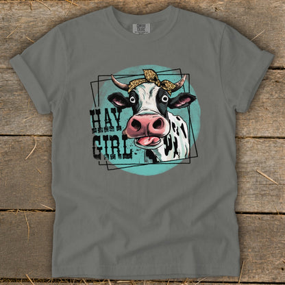 Grey t-shirt with a cow wearing a bandana and the text "Hay Girl".